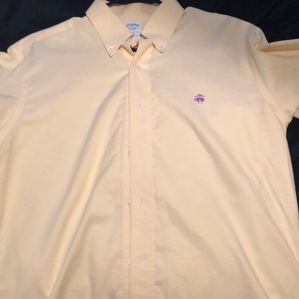 Brooks Brothers yellow button down shirt.